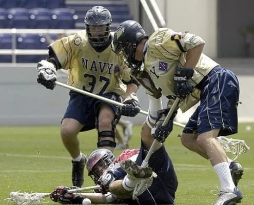lacrosse two players battle for a loose ball