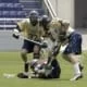 lacrosse two players battle for a loose ball