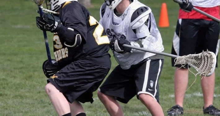 youth lacrosse body defense before stick checks