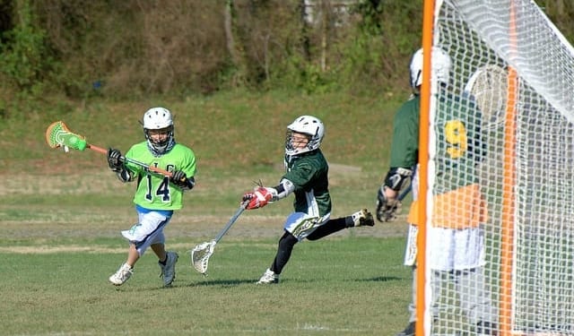 youth lacrosse righty sweep dodge into slot