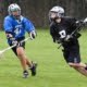 youth lacrosse run with eyes up