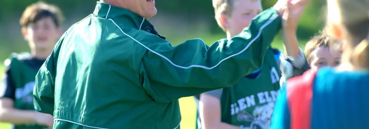 Coach Talking to Players